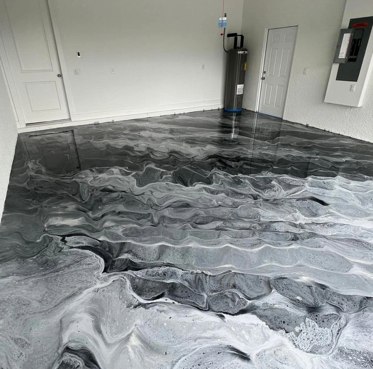 Metallic epoxy pour — premium black and white marble finish